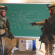 Staff Sgt. Cornelius Woods debriefs Pfc. Jack Colin.